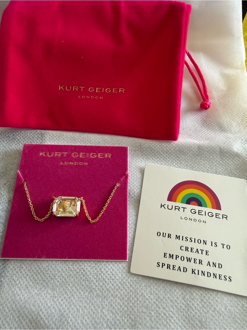 Kurt Geiger Gold Crystal Pendant Necklace with Hot Pink Pouch